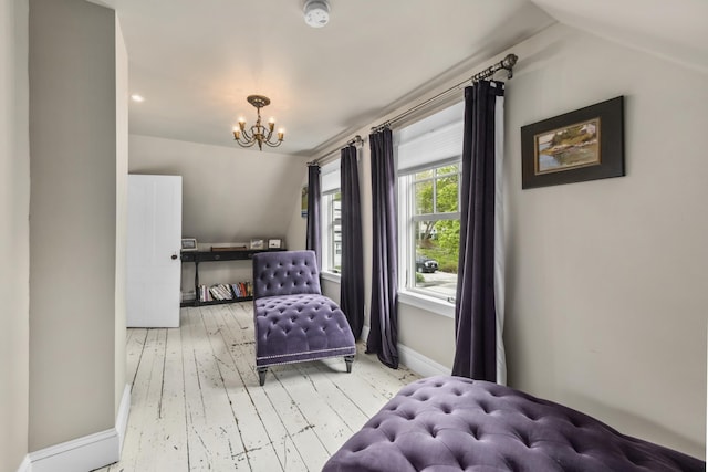 16 Cross St, Camden, ME 04843 - bedroom with a chandelier, wood-type flooring, baseboards, and lofted ceiling