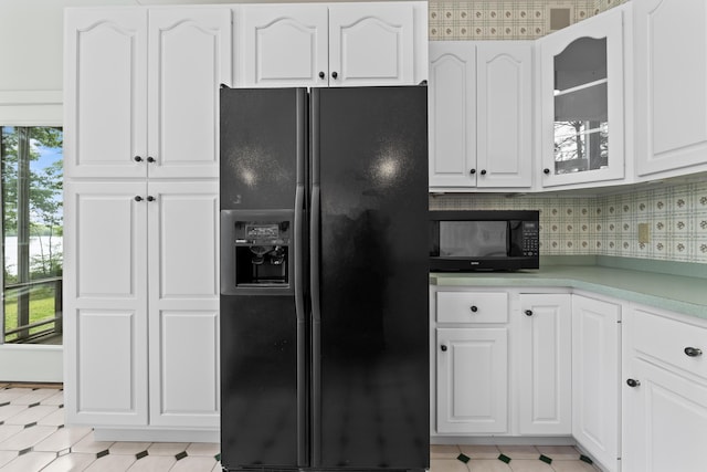 73 Hodsdon Ln, Jefferson, ME 04348 - kitchen featuring black appliances, white cabinets, glass insert cabinets, light countertops, and light floors
