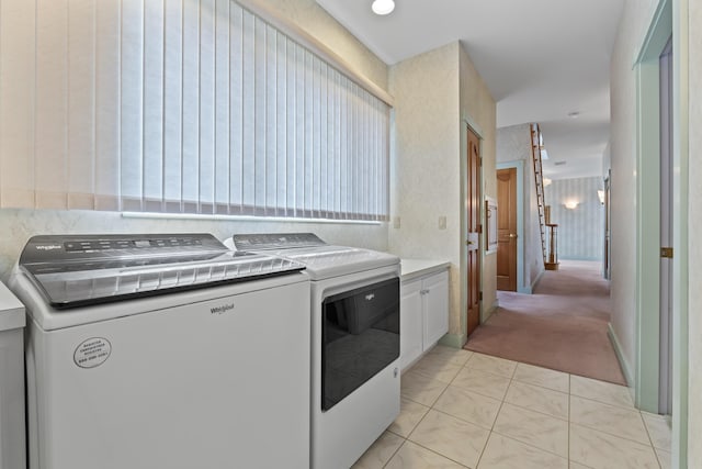73 Hodsdon Ln, Jefferson, ME 04348 - laundry area featuring cabinet space, washing machine and clothes dryer, and light carpet