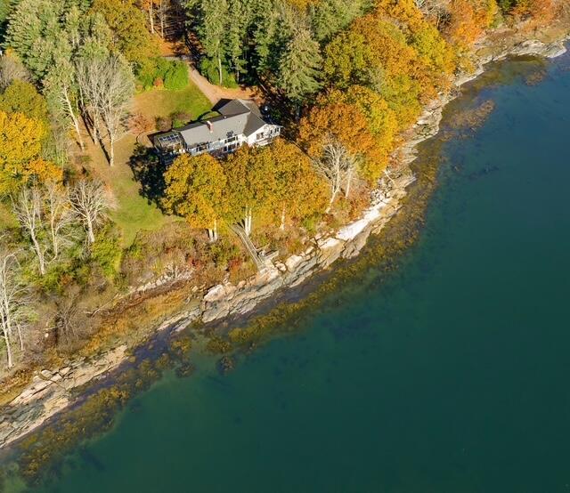 21 Ledge Rd, Cumberland, ME 04110 - aerial view of property's location featuring a heavily wooded area and a nearby body of water