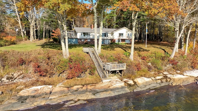 21 Ledge Rd, Cumberland, ME 04110 - view of front of property featuring a water view, stairway, and a front lawn