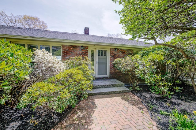 21 Ledge Rd, Cumberland, ME 04110 - doorway to property with brick siding and a chimney