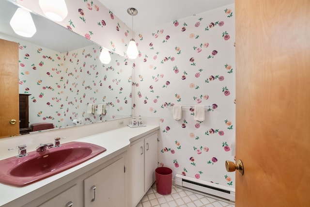 21 Ledge Rd, Cumberland, ME 04110 - bathroom with a baseboard heating unit, vanity, wallpapered walls, and tile patterned floors
