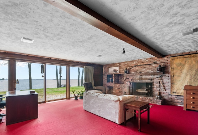 21 Ledge Rd, Cumberland, ME 04110 - living room with a textured ceiling, a water view, brick wall, a brick fireplace, and carpet floors