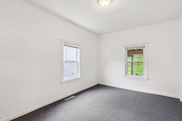 520 Lincoln St, Lewiston, ME 04240 - spare room with dark colored carpet and baseboards