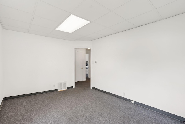 520 Lincoln St, Lewiston, ME 04240 - empty room featuring a paneled ceiling, carpet flooring, and baseboards