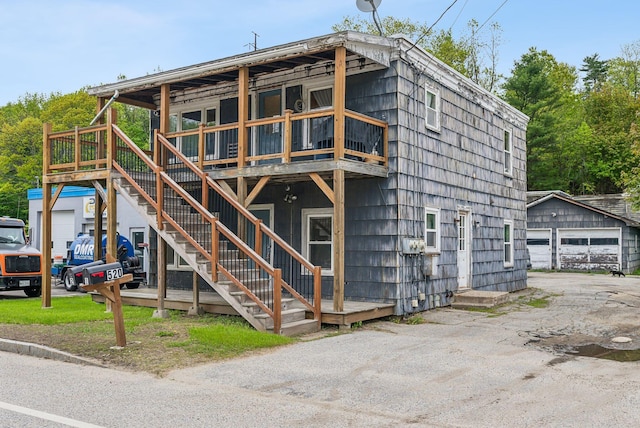 520 Lincoln St, Lewiston, ME 04240 - view of front of property featuring an outdoor structure, a deck, and a detached garage