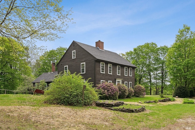 19 Bearce Rd, Winthrop, ME 04364 - view of side of home with a chimney, a yard, and roof with shingles