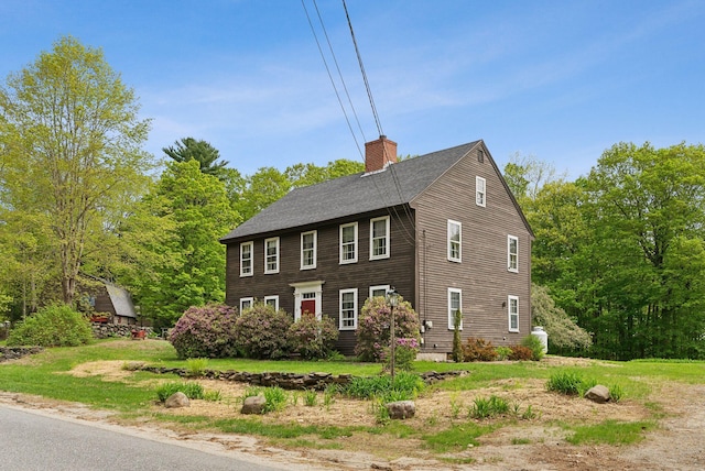 19 Bearce Rd, Winthrop, ME 04364 - view of front facade featuring a chimney and a shingled roof