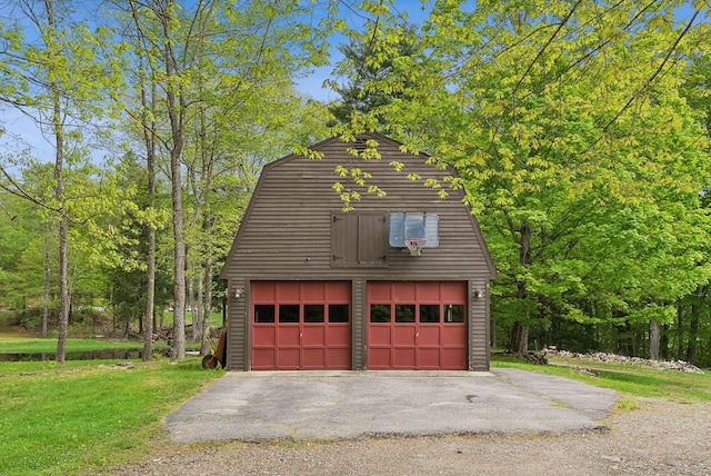 19 Bearce Rd, Winthrop, ME 04364 - view of home's exterior featuring a garage, an outdoor structure, a gambrel roof, and a yard