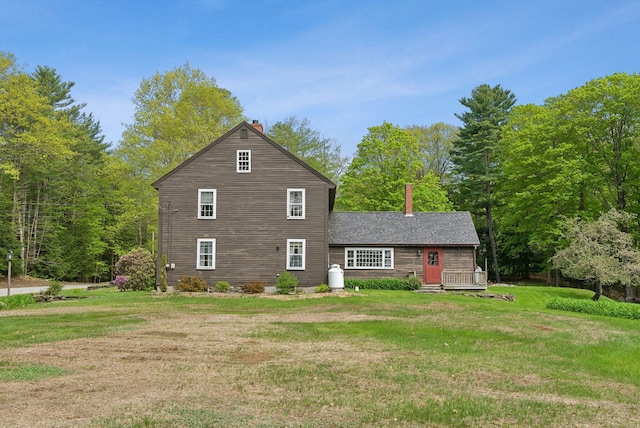 19 Bearce Rd, Winthrop, ME 04364 - view of front of property featuring a chimney, a front yard, and a deck