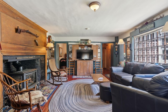19 Bearce Rd, Winthrop, ME 04364 - living room with a wood stove and wood finished floors