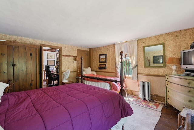 19 Bearce Rd, Winthrop, ME 04364 - bedroom with radiator heating unit, wallpapered walls, and wood finished floors