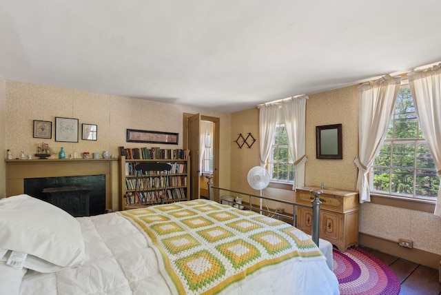 19 Bearce Rd, Winthrop, ME 04364 - bedroom with multiple windows, wallpapered walls, and a fireplace