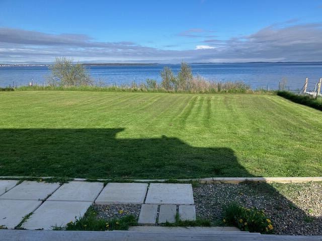 66 Robins St, Robbinston, ME 04671 - view of grassy yard featuring a water view