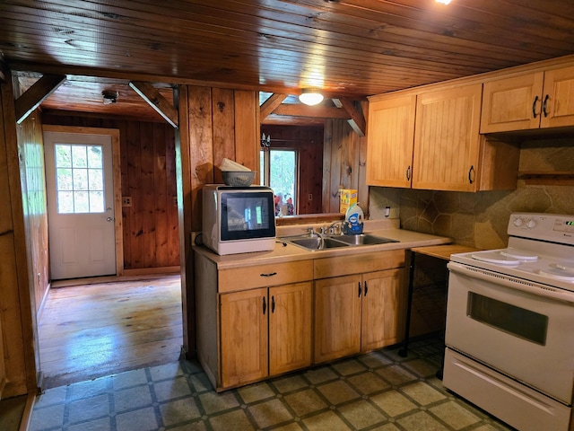 1330 Pushaw Rd, Glenburn, ME 04401 - kitchen with white electric range oven, a sink, wooden ceiling, light countertops, and wood walls