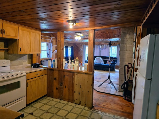 1330 Pushaw Rd, Glenburn, ME 04401 - kitchen featuring white appliances, wood ceiling, plenty of natural light, ceiling fan, and light countertops
