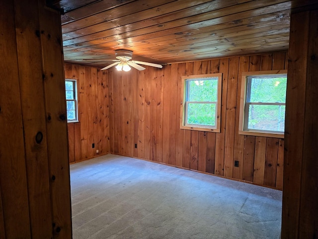 1330 Pushaw Rd, Glenburn, ME 04401 - spare room with wooden ceiling, carpet, ceiling fan, and wood walls