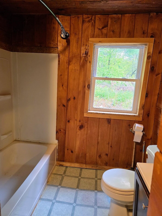 1330 Pushaw Rd, Glenburn, ME 04401 - full bath featuring wooden walls, toilet, tile patterned floors, and vanity