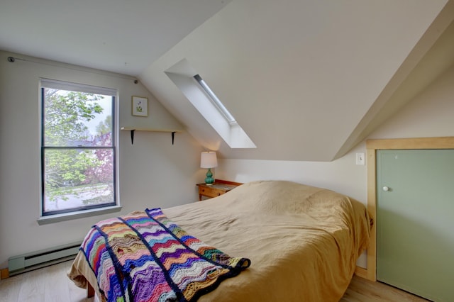5 Glenridge Dr Unit 5, Portland, ME 04102 - bedroom featuring a baseboard heating unit, a skylight, wood finished floors, and lofted ceiling