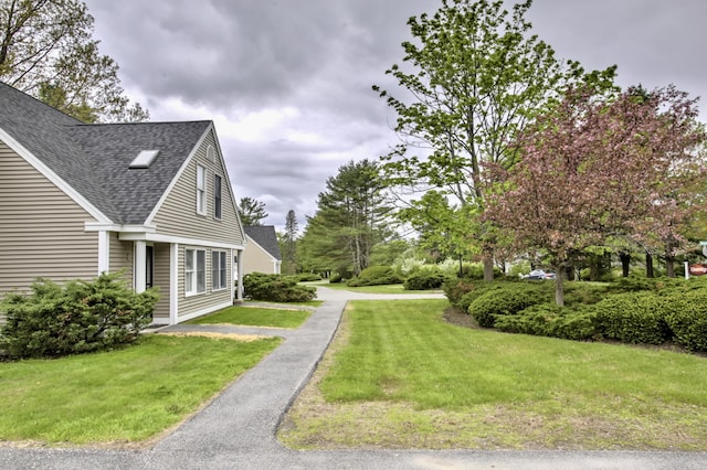 5 Glenridge Dr Unit 5, Portland, ME 04102 - view of property exterior featuring roof with shingles and a lawn