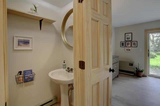 5 Glenridge Dr Unit 5, Portland, ME 04102 - bathroom featuring healthy amount of natural light, wood finished floors, a sink, and baseboard heating