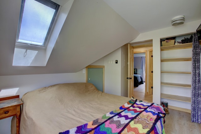 5 Glenridge Dr Unit 5, Portland, ME 04102 - bedroom with wood finished floors, lofted ceiling, and a skylight