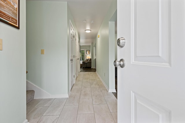 14 Chickadee Cir Unit 14, Brunswick, ME 04011 - corridor with light tile patterned floors, stairway, and baseboards