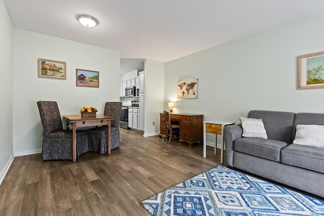 14 Chickadee Cir Unit 14, Brunswick, ME 04011 - living room with dark wood finished floors, baseboards, and a desk