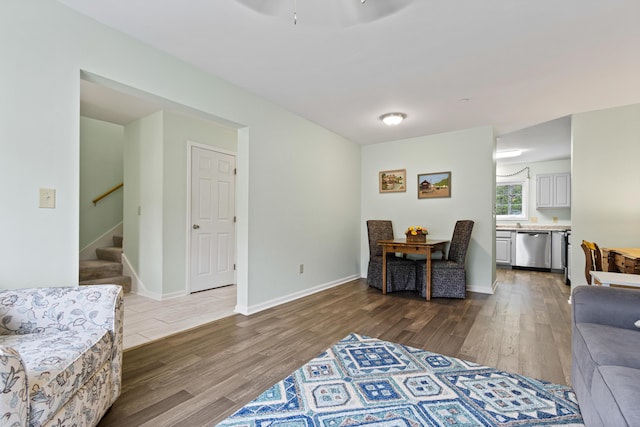14 Chickadee Cir Unit 14, Brunswick, ME 04011 - living room featuring wood finished floors, stairs, and baseboards