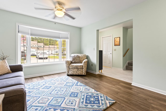 14 Chickadee Cir Unit 14, Brunswick, ME 04011 - living room with stairway, wood finished floors, ceiling fan, and baseboards