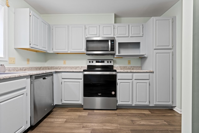 14 Chickadee Cir Unit 14, Brunswick, ME 04011 - kitchen featuring stainless steel appliances, light countertops, white cabinets, and dark wood-type flooring