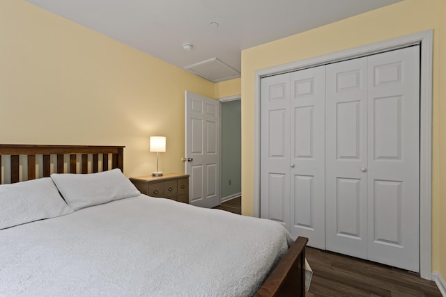 14 Chickadee Cir Unit 14, Brunswick, ME 04011 - bedroom with dark wood finished floors, attic access, a closet, and baseboards
