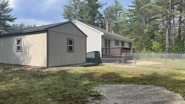 60 Twig Cir, Harrison, ME 04040 - view of side of home featuring a chimney and a deck