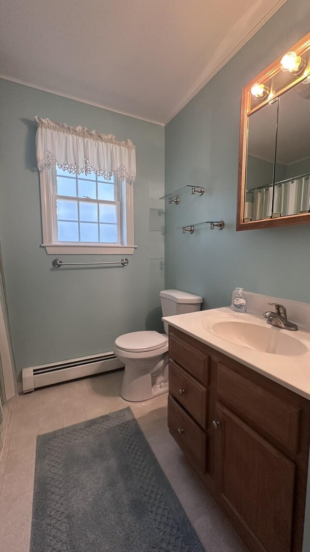 60 Twig Cir, Harrison, ME 04040 - bathroom with a baseboard heating unit, vanity, ornamental molding, toilet, and tile patterned floors