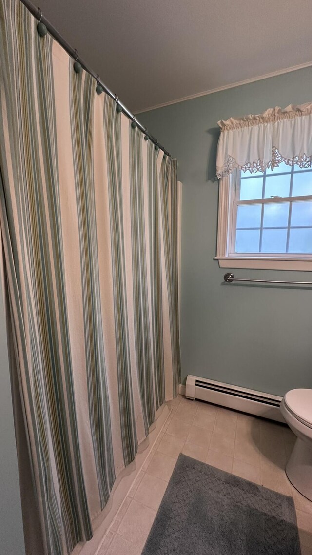 60 Twig Cir, Harrison, ME 04040 - full bath featuring a baseboard heating unit, toilet, tile patterned flooring, and crown molding