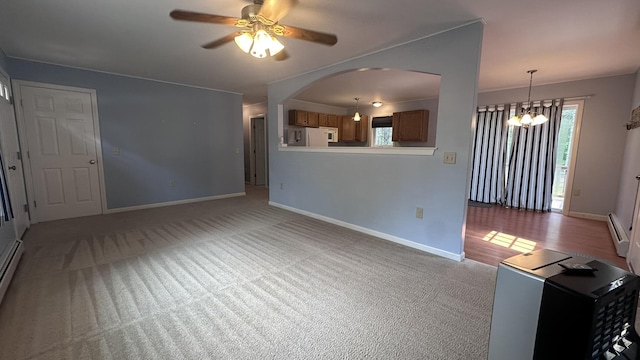 60 Twig Cir, Harrison, ME 04040 - unfurnished living room featuring a ceiling fan, carpet flooring, a baseboard radiator, and baseboards