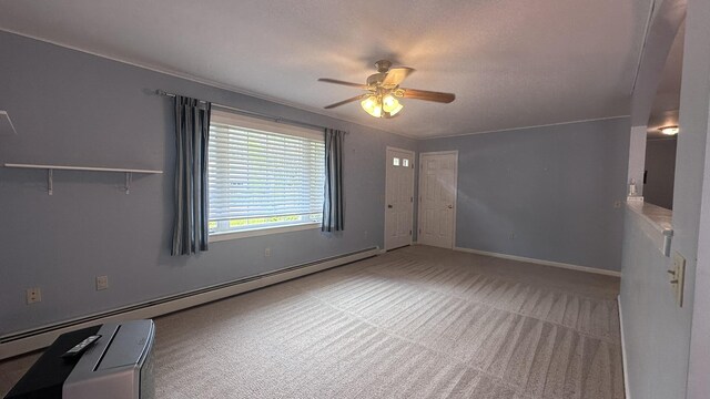 60 Twig Cir, Harrison, ME 04040 - carpeted spare room with a baseboard heating unit, ceiling fan, and baseboards