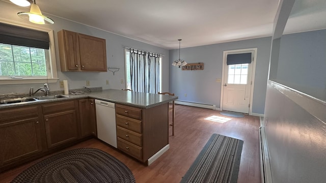 60 Twig Cir, Harrison, ME 04040 - kitchen with white dishwasher, baseboard heating, a sink, a peninsula, and dark wood-style floors