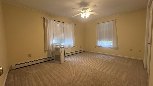 60 Twig Cir, Harrison, ME 04040 - spare room with a baseboard radiator, light colored carpet, a ceiling fan, and baseboards