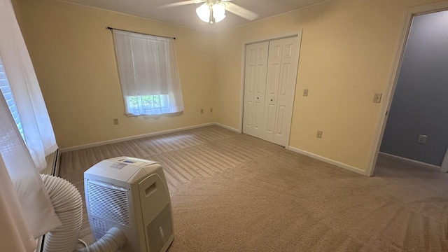 60 Twig Cir, Harrison, ME 04040 - unfurnished bedroom with carpet floors, a closet, baseboards, and a ceiling fan