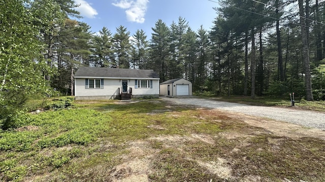 60 Twig Cir, Harrison, ME 04040 - view of front facade with an outbuilding, gravel driveway, entry steps, and a detached garage