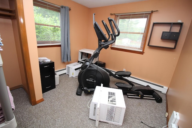 workout area with carpet flooring, baseboards, and a baseboard radiator