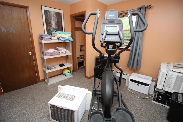 workout area featuring carpet flooring and baseboards