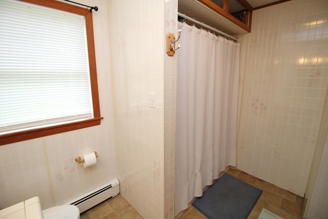bathroom with baseboard heating, a shower with curtain, and toilet