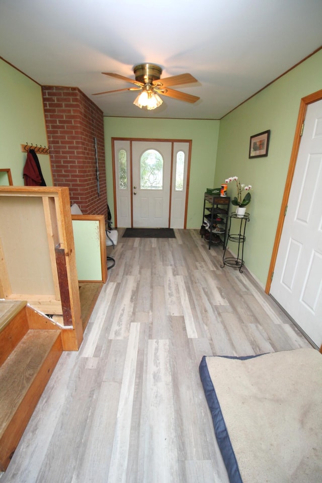 entryway featuring wood finished floors and ceiling fan