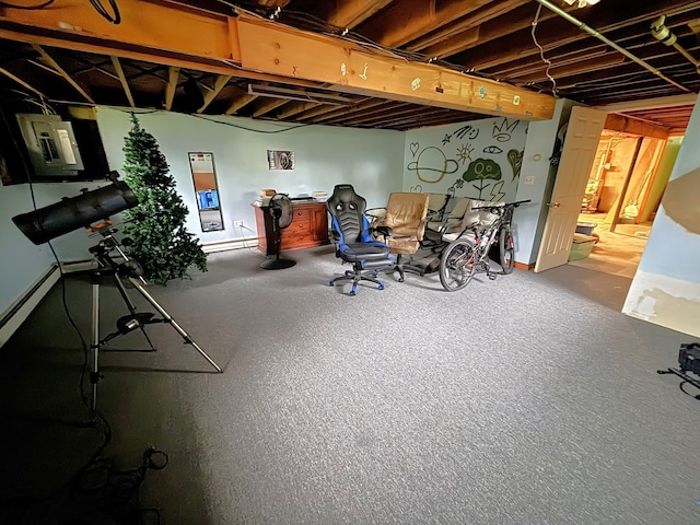 basement with a baseboard heating unit and baseboards