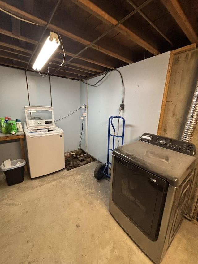 finished basement with washer and clothes dryer