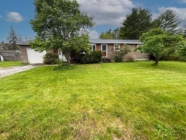 view of front of home featuring an attached garage and gravel driveway