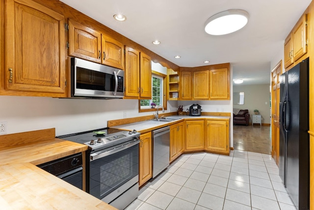 18 Ginger Ln, Saco, ME 04072 - kitchen with stainless steel appliances, a sink, light tile patterned floors, open shelves, and recessed lighting